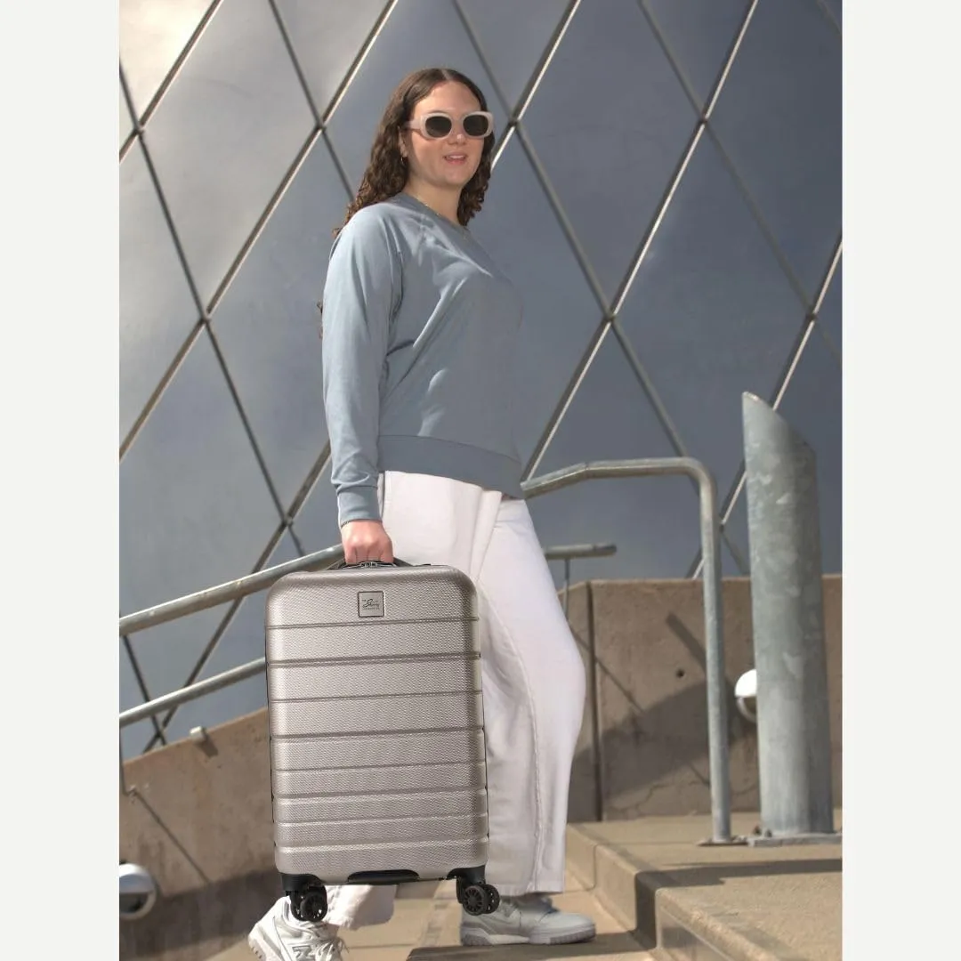 Skyway Epic 2.0 Hardside Lightweight and Durable ABS Shell Luggage, Spacious with Dual Spinning Wheels, Comfort Grip, Men and Women, 24-inch Medium Check-In, Bone
